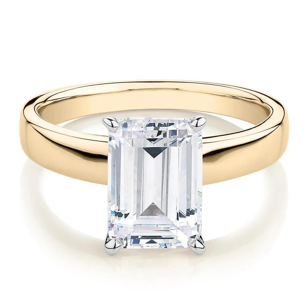 Emerald Cut solitaire engagement ring with 3.01 carat* diamond simulant in 14 carat yellow and white gold